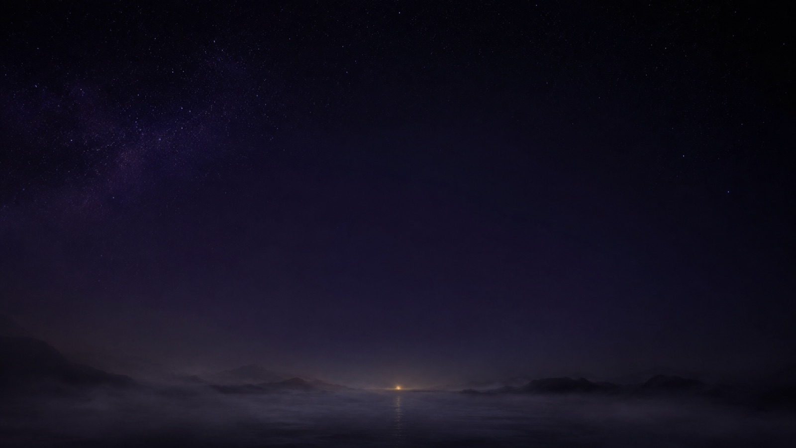 霧の海のむこうに小さな灯りがともる、星空の夜景